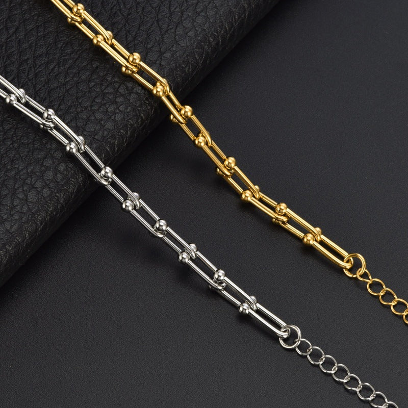 Elegantes Damenarmband aus Titanstahl – Gold- oder Silberoptik – Modernes Hufeisen-Design