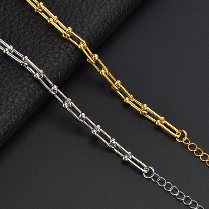 Elegantes Damenarmband aus Titanstahl – Gold- oder Silberoptik – Modernes Hufeisen-Design