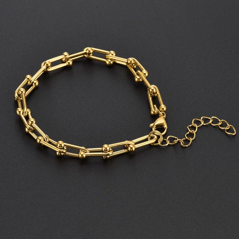 Elegantes Damenarmband aus Titanstahl – Gold- oder Silberoptik – Modernes Hufeisen-Design